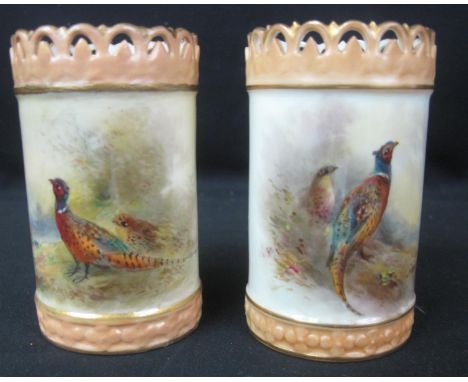 PAIR OF ROYAL WORCESTER PORCELAIN CYLINDER VASES hand painted with brace of pheasants on a mountain, one signed J Stinton, 9c