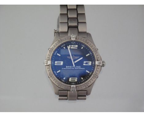 BREITLING AEROSPACE QUARTZ CHRONOMETER having steel case with steel bezel, black face with Arabic and baton numerals, two ill