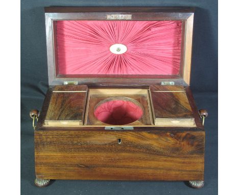 AN EARLY 19TH CENTURY ROSEWOOD TEA CADDY, of sarcophagus form having hinged lid, the interior revealing two lidded canisters 