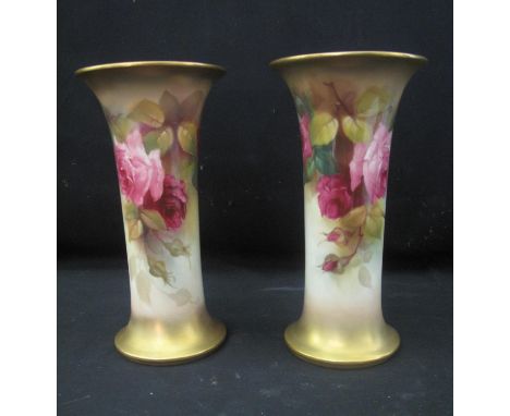 TWO SIMILAR ROYAL WORCESTER PORCELAIN TRUMPET VASES decorated with roses and foilage, signed by Kitty Blake & E. Spilsbury. P