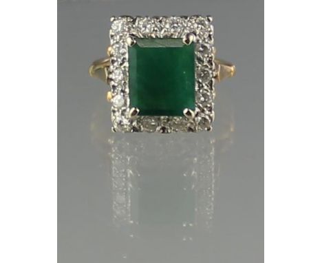 LARGE EMERALD AND DIAMOND RING. The step cut emerald approx 10 x 9mm, surrounded by 14 diamonds. Ring size N, weight 93.4g ap