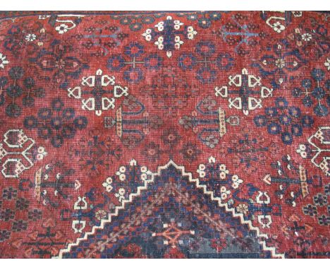 PERSIAN JOSHAGHAN WOOL CARPET on a red ground, central lozenge surrounded by other stylised floral and foliate decoration. 12