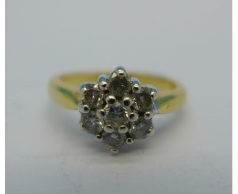 An 18ct gold and diamond cluster ring, marked 0.5ct on shank, 3.7g, H