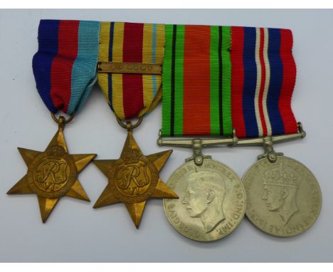 A set of four WWII medals including The Africa Star with 8th Army bar
