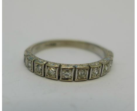 An 18ct white gold and ten stone diamond ring, 3g, N