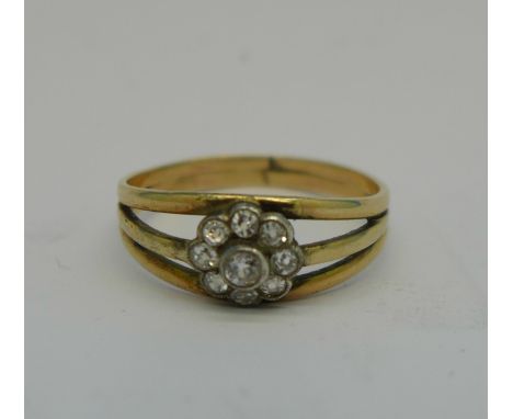 A yellow metal and diamond ring, 2.3g, S