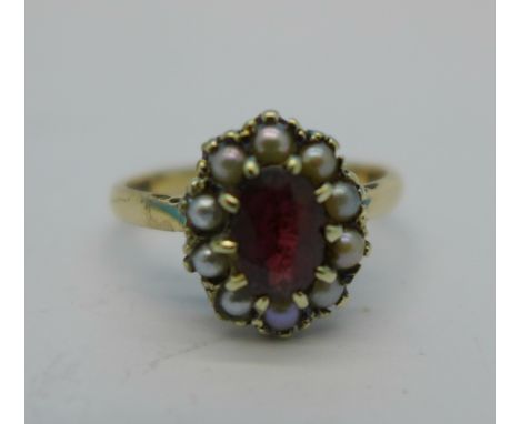 A 9ct gold garnet and pearl ring, 3.1g, O