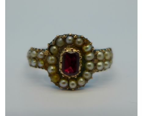 A yellow metal, pearl and red stone ring, 2.4g, N