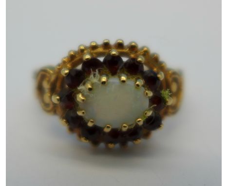 A 9ct gold, opal and garnet cluster ring, 3.3g, Q