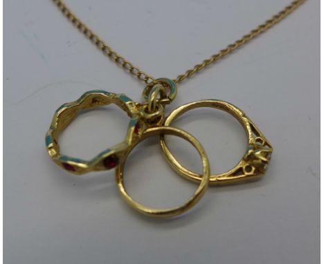 A 9ct gold ring pendant and chain, 4.1g