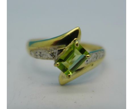 A 9ct gold, peridot and diamond ring, 1.1g, O
