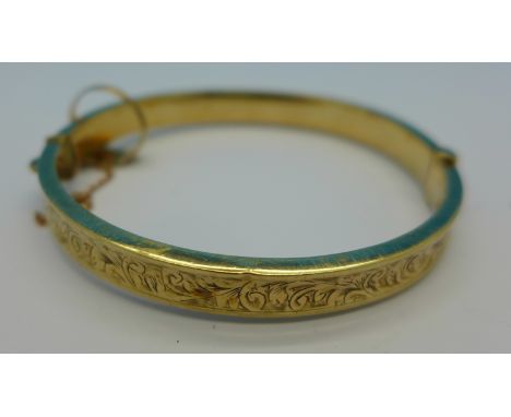 A 9ct gold bangle, 10.5g