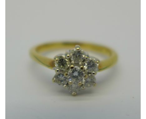 An 18ct gold and diamond cluster ring, 0.5ct diamond weight marked on shank, 3.2g, M