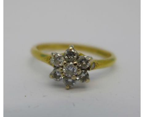 An 18ct gold and diamond cluster ring, marked 0.38 on shank, 2.5g, N