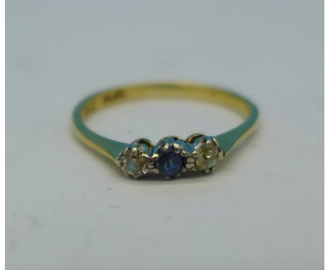 An 18ct gold and three stone sapphire and diamond ring, 1.7g, L