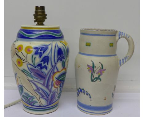 A Poole table lamp designed by Truda Carter, TZ pattern mark, with leaping deer and a Poole jug