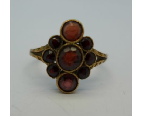 A 9ct gold and garnet ring, 2g, N