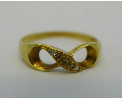 An 18ct gold five stone ring, 2.4g, N