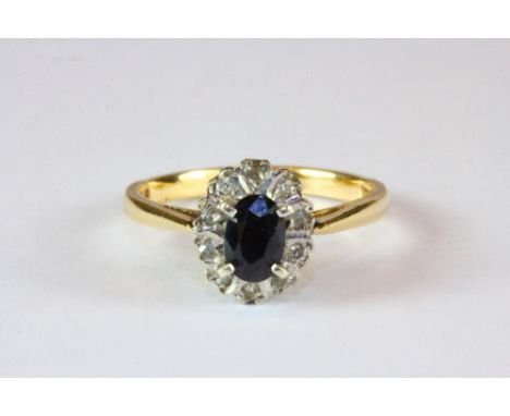 A 9ct gold sapphire and diamond cluster ring (M.5).