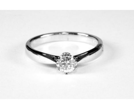 An 18ct white gold diamond solitaire ring (M.5).