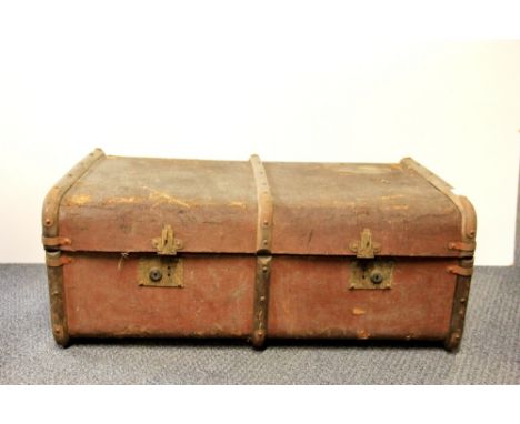 A canvas and wood cabin trunk.