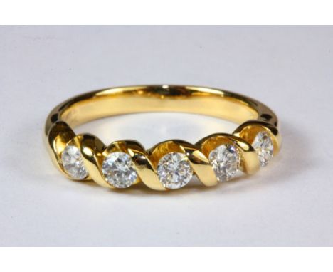 A lovely 18ct yellow gold five diamond ring, (M).