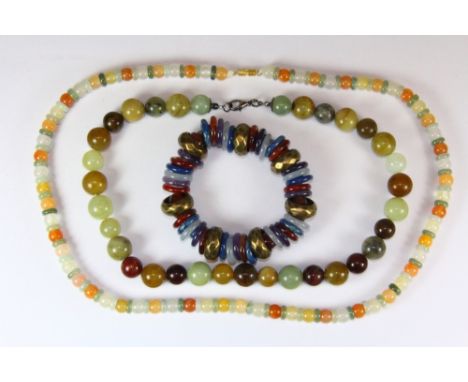 Two jade / hardstone necklaces and a semi precious stone bracelet.