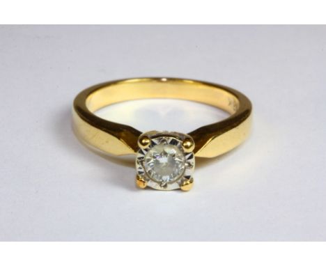 An 18ct yellow gold diamond solitaire ring, (M.5).
