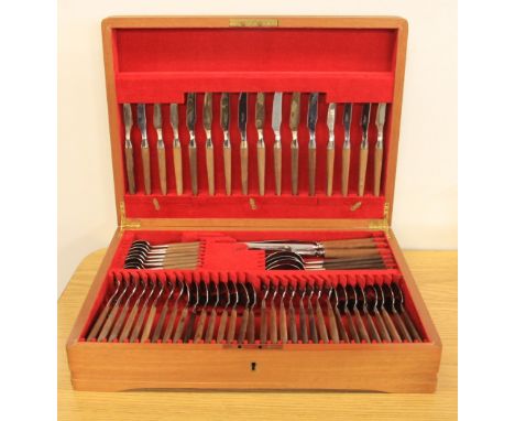 A vintage cased wood and stainless steel cutlery set.