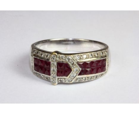 An 18ct white gold ruby and diamond set buckle ring (N.5).