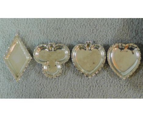 A set of four playing card suit scalloped edge pin trays hallmarked: A &amp; JZ for A &amp; J Zimmerman Ltd., Birmingham, 189