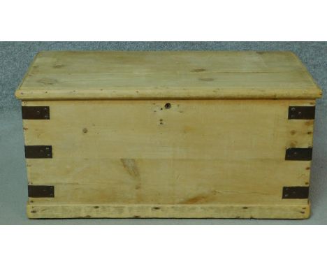 A 19th century pine metal bound trunk. H.38 W.81 D.43cm 