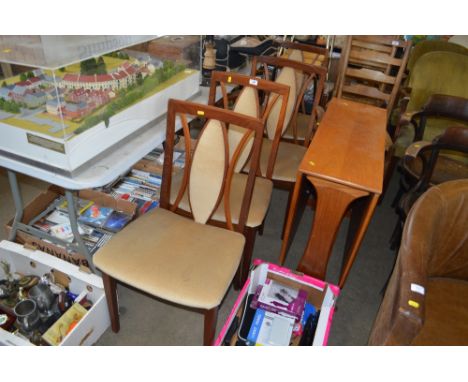 A G-Plan dining table together with a set of four chairs