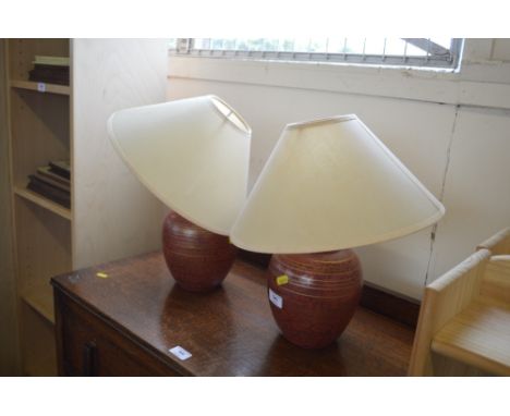 A pair of table lamps lacking leads