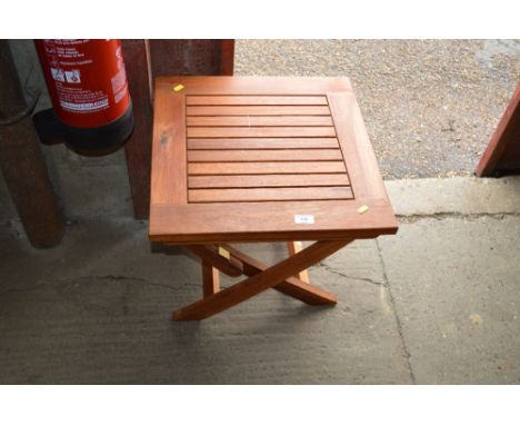 A teak folding garden table