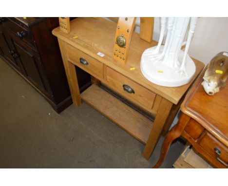 A light oak hall table fitted two drawers