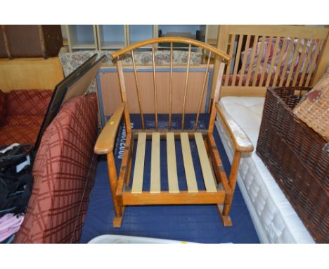 A stick back rocking chair lacking cushion