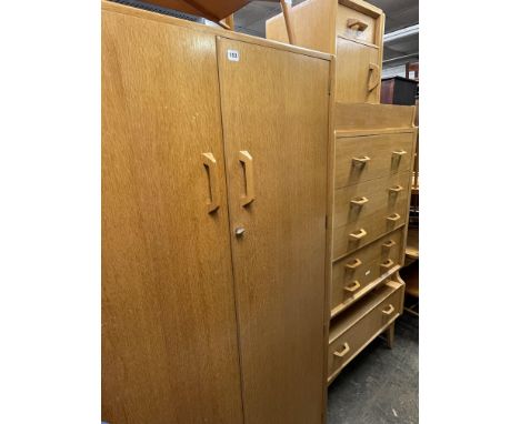 1960S FOUR PIECE LIGHT OAK BEDROOM SUITE INCLUDING WARDROBE, DRESSING TABLE, CHEST OF DRAWERS AND BEDSIDE CABINET