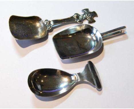Spoon with hammered shovel bowl and celtic cross grip, Chester 1938, another with rectangular open grip, by Bradburys, 1928, 