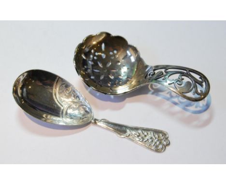Spoon by R Pringle, 1946 with pierced circular bowl and grip, and another by W Deakin, Birmingham 1908.&nbsp; (2)