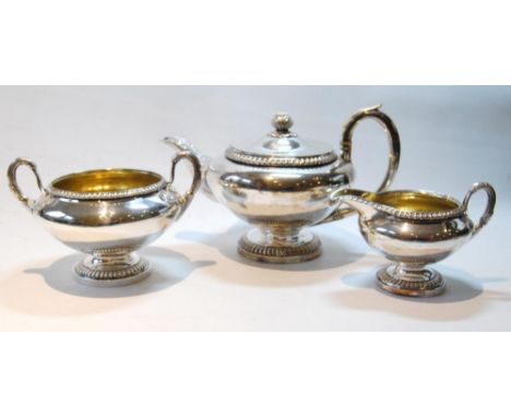 Silver three-piece tea set by R Gray &amp; Sons, Glasgow 1825, of compressed spherical form with gadrooned edges and reeded l