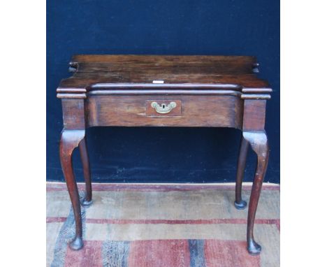 18th century and later Irish-style mahogany card table with a shaped fold-over top enclosing a later surface, above a short d