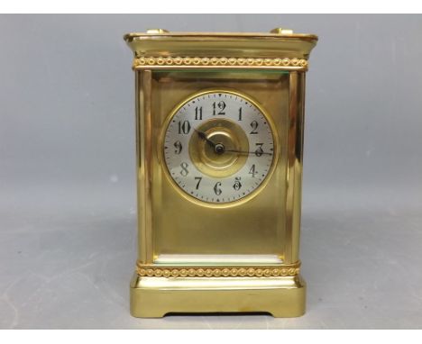 Brass four-glass carriage clock with silvered dial and brass frame  