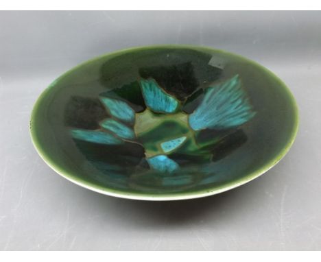 1966 Poole Pottery shallow bowl with a stylised green glazed centre, 11ins diam 