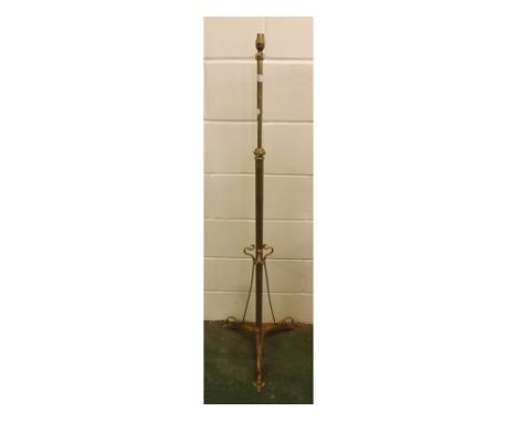 Art Nouveau stylised brass adjustable lamp stand on three spade style feet, with twisted brass supports, 57ins tall 