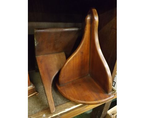 Georgian mahogany wall mounted clock bracket together with a further demi-lune mahogany clock bracket (2)  