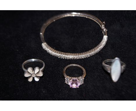 3 Silver dress rings together with a silver bangle 