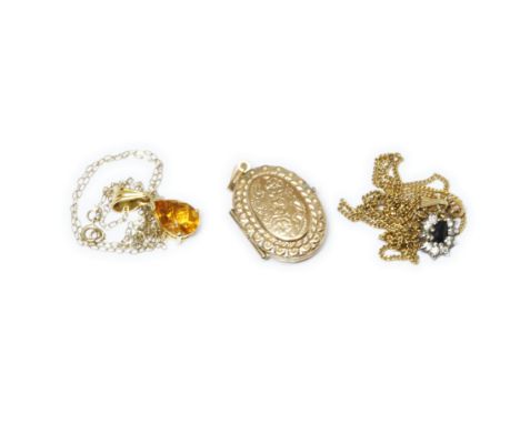 A mixed lot of 9ct gold comprising a locket and two pendants on chains, gross weight 6.9g.