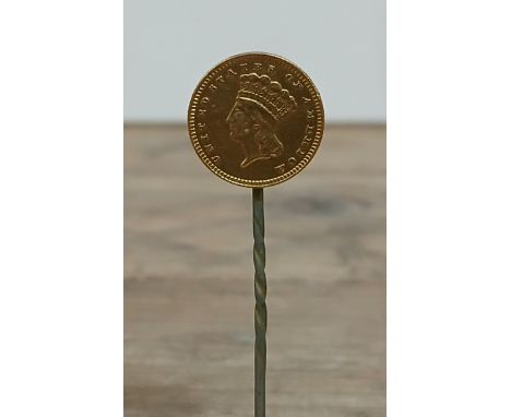 A 19th century USA one dollar gold coin soldered on a stick pin.