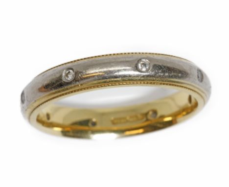 A two colour 18ct gold diamond wedding band, outer white gold band set with eight round brilliant diamonds, inner yellow gold